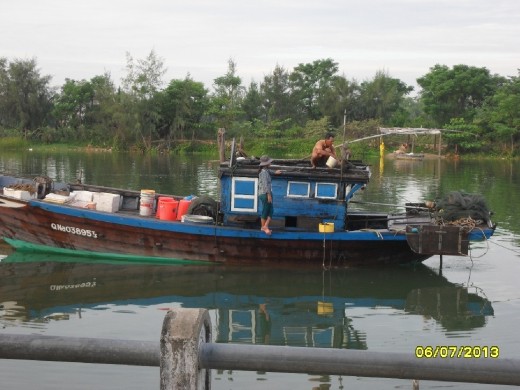 Boat on river in morning Hoi An