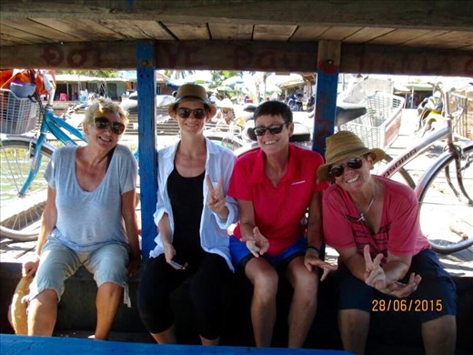 Ladies on bike ride and now on ferry back to HoiAn