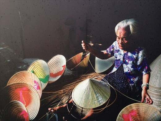 Lady making conical hats