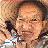 Old lady on ferry filling her tobacco pipe. : by wendyandkevin, Views[445]