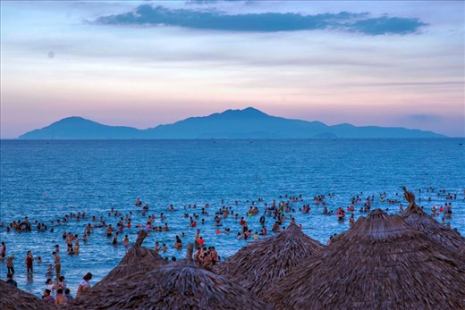 Many locals at AnBang Beach at dusk. 