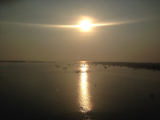 Coastal ride. Sun rising over the fishing village. 