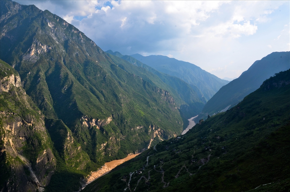 Tiger Leaping Gorge in the sunset. Only one side of the gorge is in sunlight.