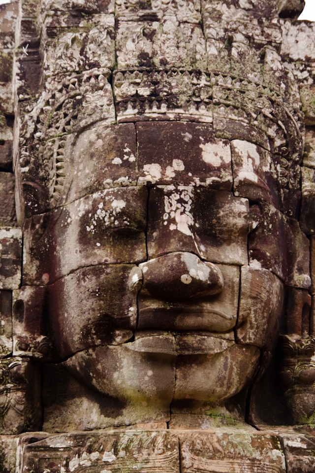 One of the many faces of the Bayon Temple, situated within the Angkor Temples.