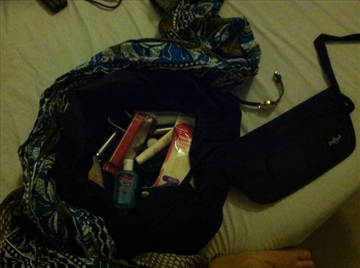 Bag for going out: scarf, wipes, Chapstick, whistle, flashlight, maps, hand sanitizer, snacks, tampon. Not pictured: folding knife and mace. 