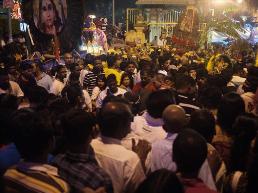 A cacophony of drums and horns, chanting and singing and a thousand conversations in foreign tongues. The shadows from a thousand lights and raised torches. The smoke from charcoal fires, braziers and cigars. The smells of incense, frying meat and vegetables and the sweat of a few hundred thousand people crammed into the area at the base of the steps to Batu Caves. This is Thaipusam!