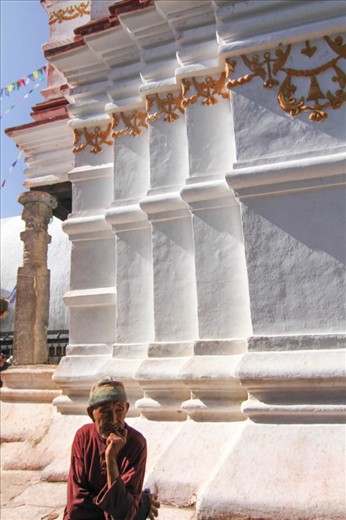 Faith is extremely important in Nepalese culture. Many travel to temples for religious reasons. This man also wears the traditional hat of the Nepalese which has been lost in the younger generation.