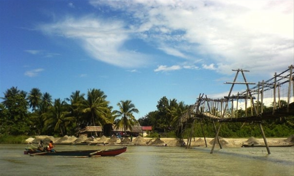 Sand miners were sent to collectors through the river in Lembomawo Poso, Central Sulawesi. sand is used for building materials to build houses around there.