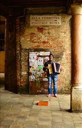 A local busker smiles as he plays a familiar tune on his accordion. I dropped a coin into his shoebox and he quietly thanked me in Italian. This was the moment, with  music bouncing off every time-warn surface, that I understood the allure of Venice. : by will_eades, Views[281]