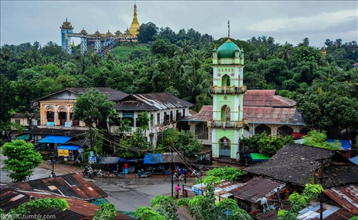 Tropical mosque, over shadowed by the old Moulmein pagoda 