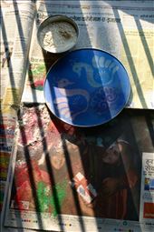 Like Christmas in the United States, Diwali has become a highly capitalized on holiday. In this photo I like the juxtaposition of the shadows from the rising sun onto a newspaper selling “Hot Diwali Deals” as we created the Rangoli. In my mind this was a metaphor of the old traditions winning out as my mom used the newspaper to pick up the excess sand she spilled, paying no attention to what it was selling.  : by willow_post, Views[475]