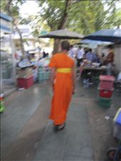 Contemplation amid the rush; young Thai monk walks among street vendors.: by wisdomsearcher, Views[191]