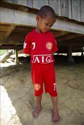 Looking wise beyond his years, this child awaits the arrival of our Xmas party.: by wkwong, Views[257]