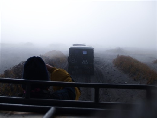 exploring sea sand of Bromo highland with morning fog