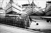At the Sunda Kelapa harbor (Jakarta), the longshoremen transfer the gas cylinders by kicking them.
Working days that pass one after the other, all the same, so inured to risks that they don't even care about anymore.: by workinindonesia, Views[1050]