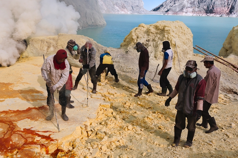 Kawah Ijen Volcano, the miners extract sulphur from the heart of the volcano, without the most basic safety equipment.
They face each day knowing that they will have to carry up and down the volcano heavy loads of sulphur on their hunched shoulders, for several kilometres, along treacherous paths with the only hope of a better life for their families.