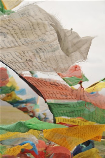 Prayers & mantras of Tibetan prayer flags blown by the wind to spread good will