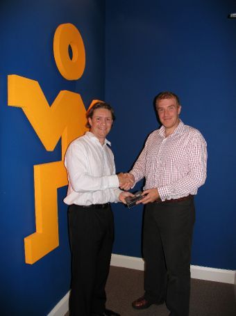 Scott, one of 3 lucky winners, gets his new iPod Nano from Nick Pound in our HQ in Sydney.