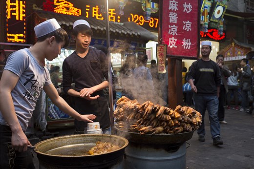 For more than 3,000 years Xi'an has been a hub of Chinese civilization. Today, the streets in the city's Muslim Quarter come alive at night with vendors and the smell of fried foods like pig feet.  