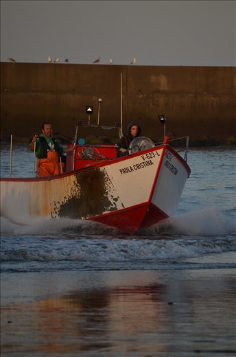 Fishermen arriving from a night out fishing