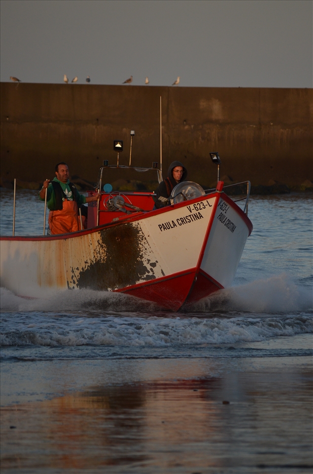 Fishermen arriving from a night out fishing