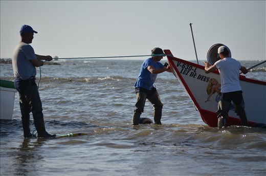 Preparing boat to be pulled out of the sea