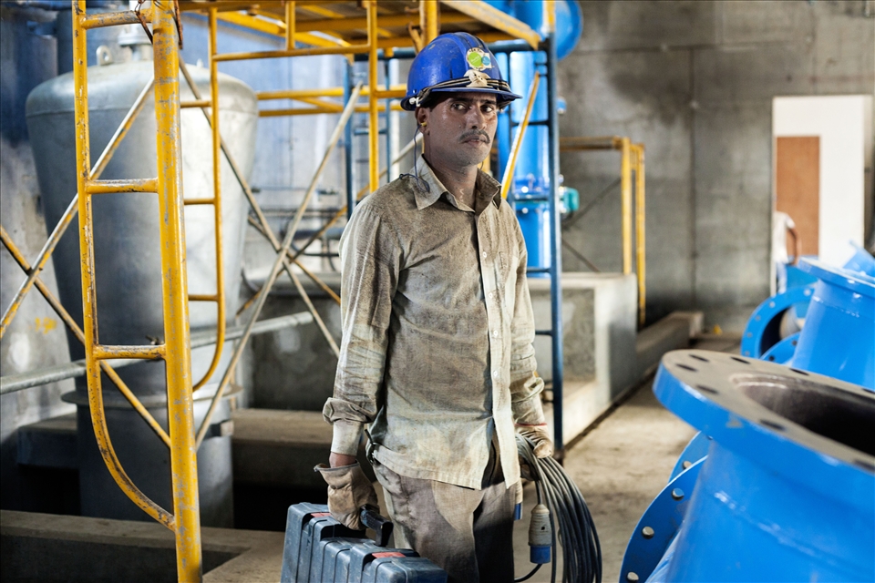 Portrait of a worker in the construction site.