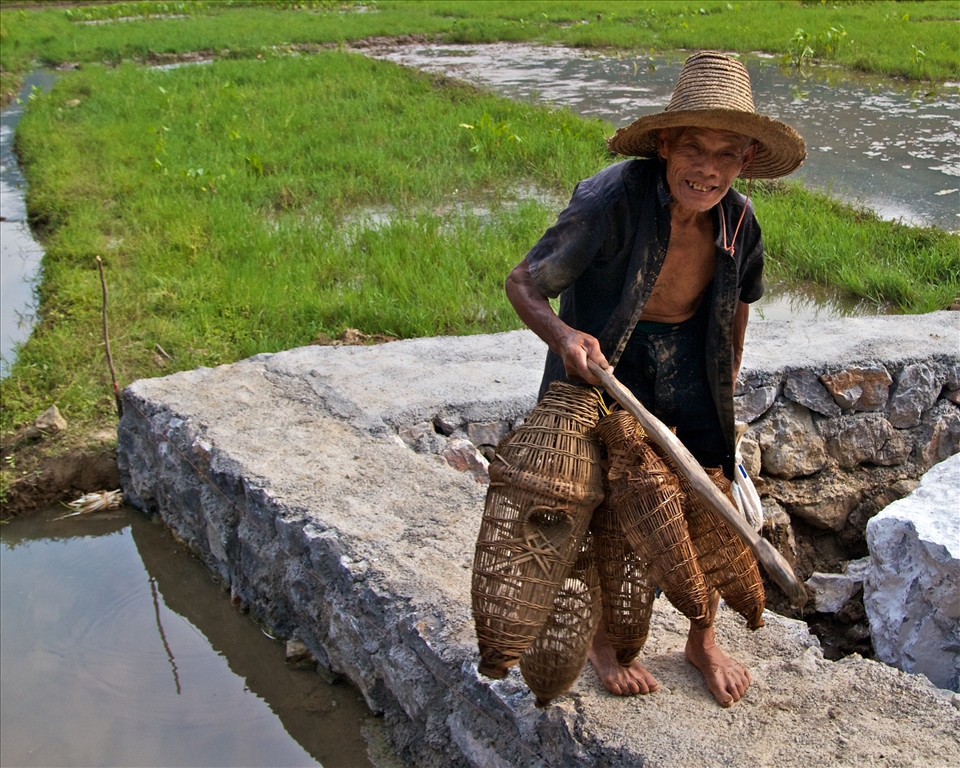 A happy guy coming home from work.  I really enjoyed meeting this man and he happily allowed me to take his photo.  He smiled when I showed him the picture.