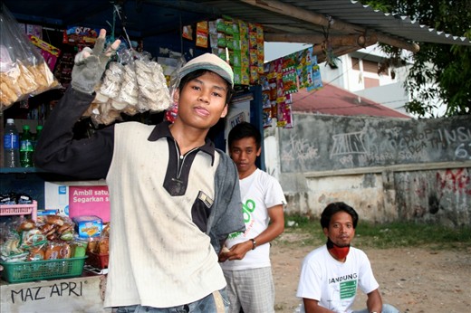Indonesia, Java Island, Jakarta.             October 2012.
Photographing people and landscapes encourage me to deeply explore every part of my voyage, building relationships with the people I photograph. I stayed 10 days in Jakarta and I talked with those 3 guys each mornings. Even if there is 10 M habitants in that city, you can really feel the community spirit.
Interesting fact: The Indonesians are so smiley in 
