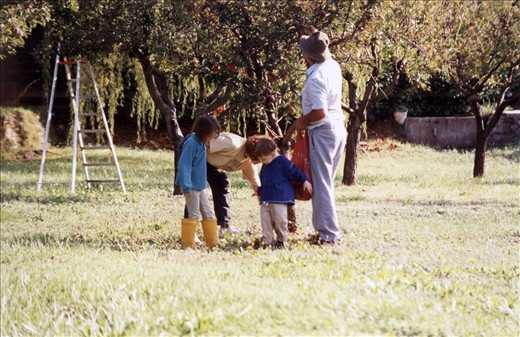 Picking fresh fruit at the farmhouse in 1995 with my brother and grandparents