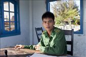 A young guard sits in his duty room, Hoi an, Vietnam 2013: by wuhao, Views[277]