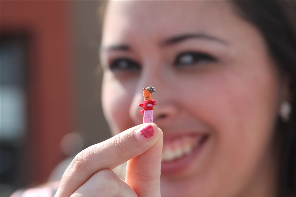 Lizette Rodriguez gently holds a fragile Native Myan 