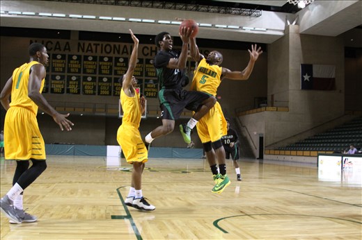 Senior Maurice O'Field (# 5)  blocks shot from opponents drive to the lane.