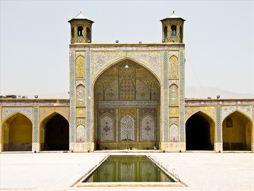 Since 1979 when the Islamic Republic of Iran was created lots of mosques have been constructed. You can easily see huge mosques in tiny villages. Locals are sometimes critic with this compulsive construction of mosques rather than spending taxes in a more reflexive way. In this picture ou can see a couple of people praying in an empty courtyard.
