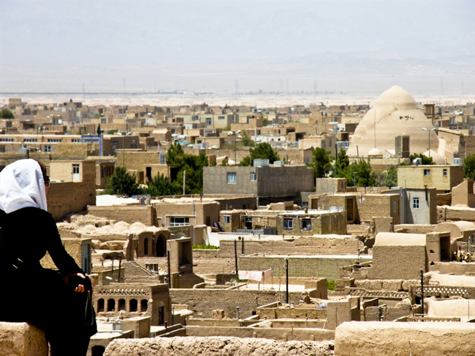 A young woman looks over the town of Meybod...maybe thinking about the past and the future of the country, maybe thinking how one of the oldest countries in the world, with a glorious past during the Persian Empire, a great variety of religions including the zoroastrians and a very modern way of living has lost so many civil rights in the past 30 years..
