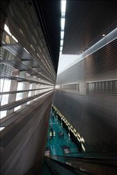 Stadium' MRT station. The architecture and design of public venues in Singapore represents and communicates power and authority. It depicts the relationship between government and citizens. Transformation of the landscape is like re writing history in both intellectual and emotional terms. Color, surface, texture, proportions and dimensions become symbols of high status, great wealth and overarching authority: by xiito, Views[1374]