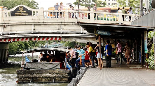 People who are waiting to get their ride at the boat station. 