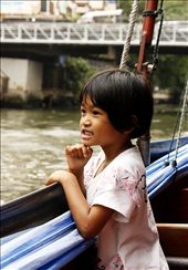 Cute little girl, enjoying the wave and scenery while riding in the boat.: by xselmae, Views[465]