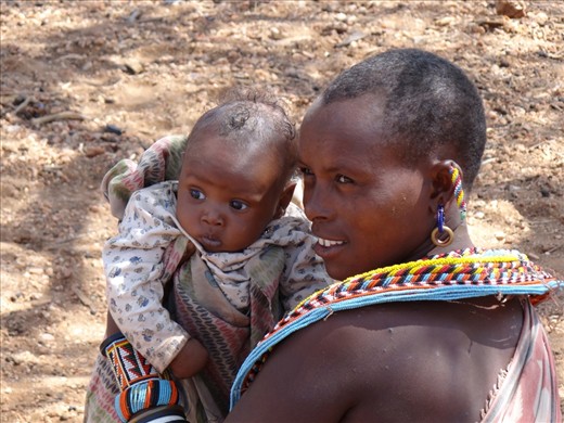 NATURAL BEAUTY - I was in amazed at how stunning this Mother and her baby are. They live in a place where clean water is not readily available and wear no make up, yet their skin is almost flawless. The happiness in the Mother's eyes and the innocence of her baby's truly made me reflect on my own materialistic items.