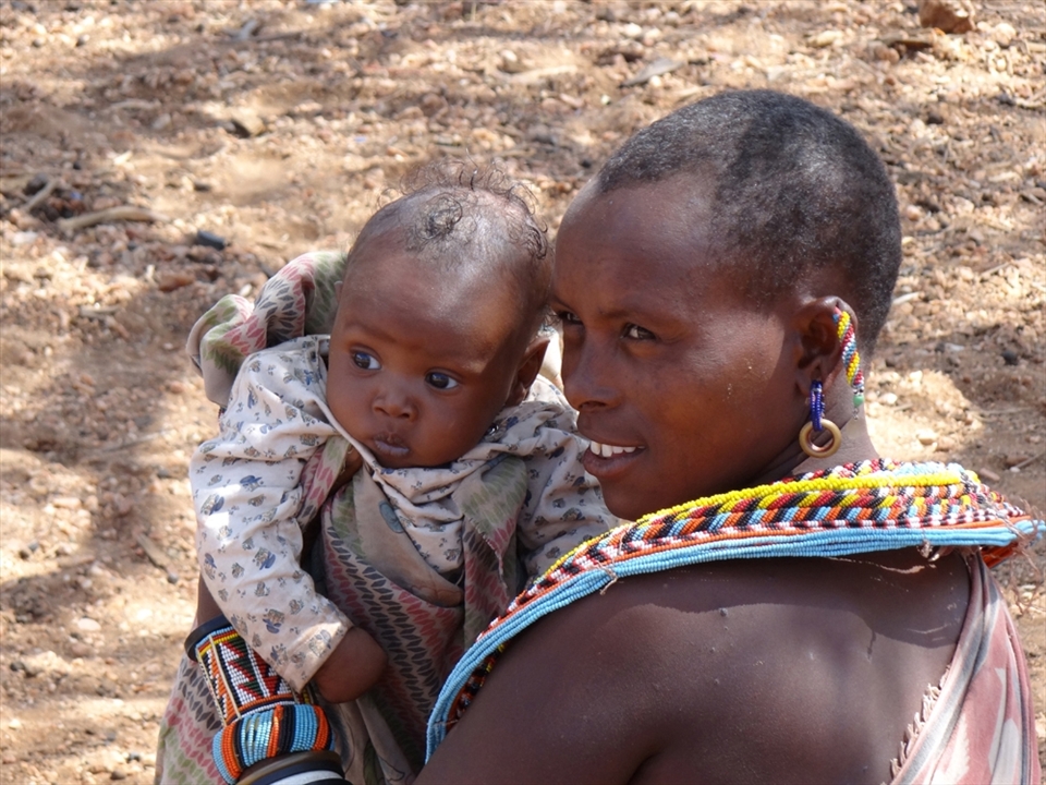 NATURAL BEAUTY - I was in amazed at how stunning this Mother and her baby are. They live in a place where clean water is not readily available and wear no make up, yet their skin is almost flawless. The happiness in the Mother's eyes and the innocence of her baby's truly made me reflect on my own materialistic items.