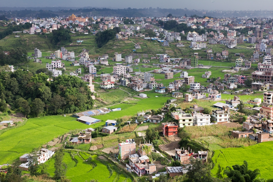 the view of houses and farms in Pokhara city