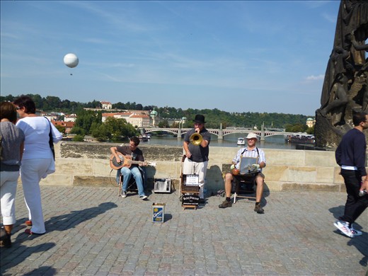 A band on the bridge brought all walks of life towards them with bright sounds.