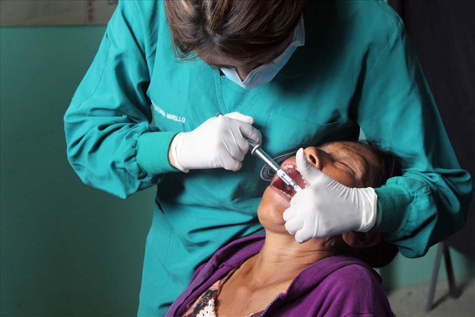 The patient receives a long awaited extraction from her familiar local doctor.