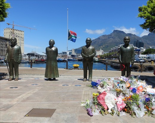 Flag at half mast and flowers at the V&A Waterfront in Cape Town in tribute to Nelson Mandela.