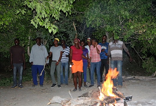 Being entertained by our amazing polers and camp staff. Okavango.
