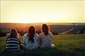 Three friends run up a massive elevated field of grass behind their farm to catch the sunset as the sun falls behind the mountains to finalize a beautiful day. : by zachhachey, Views[1941]