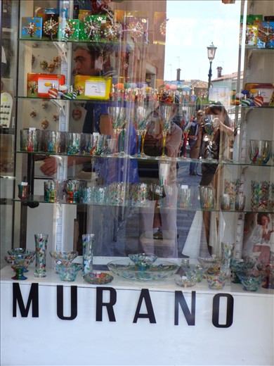 Ladies spell bound by the beauty of glass & trying to click through it