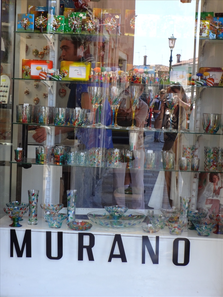 Ladies spell bound by the beauty of glass & trying to click through it