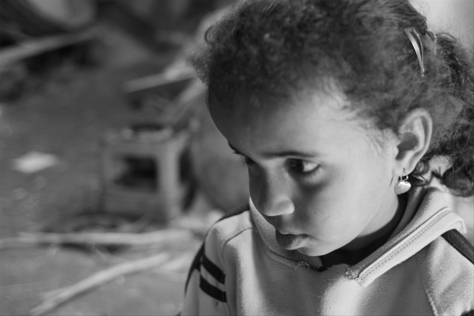 This beautiful girl was sad that her little brother was upset with her.