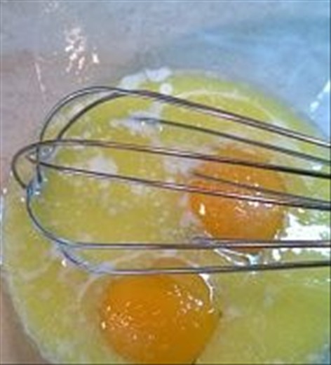 1)	First of all in a bowl, mix eggs with melted but chilled butter.